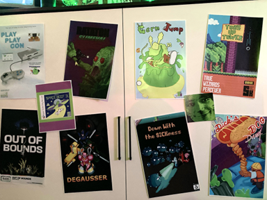 Game posters on a white cabinet